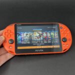 PS Vita Slim (128GB) - 580 Games | Neon Orange