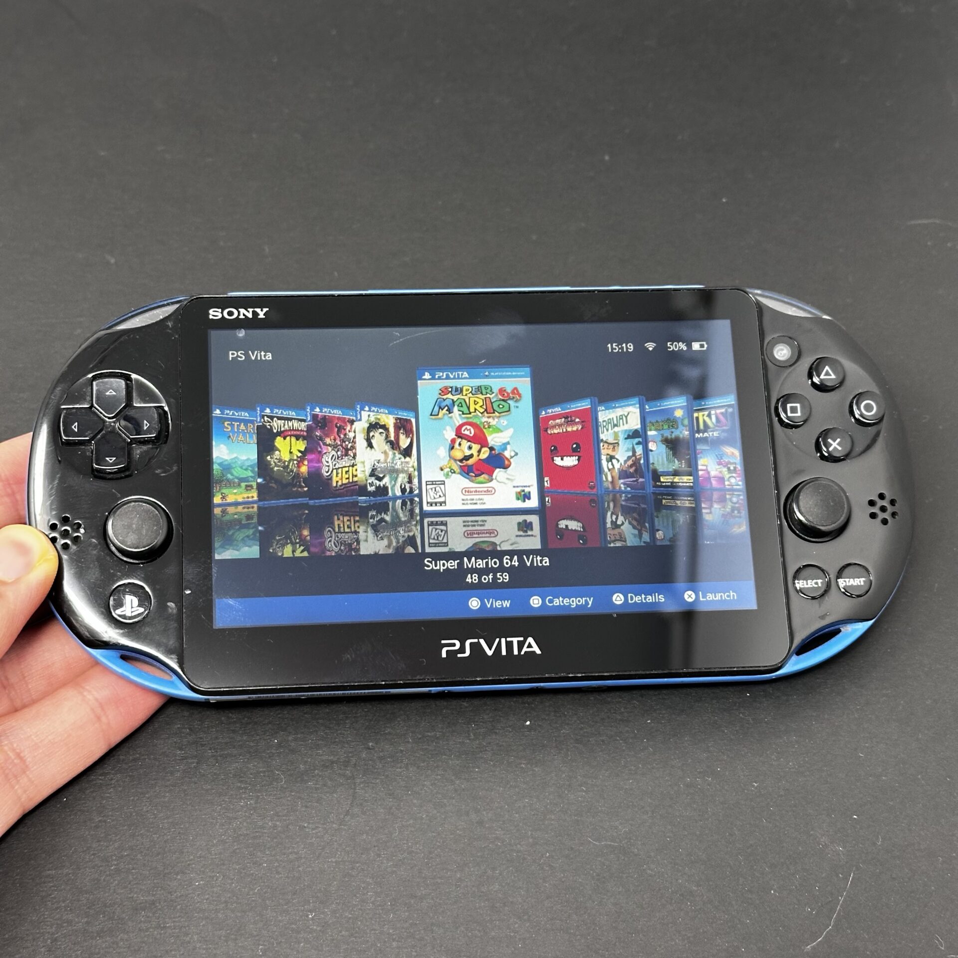 PS Vita Slim (128GB) - 580 Games | Black and Blue