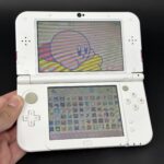 New Nintendo 3DS XL (64GB) – 600+ Games | Pink and White Edition