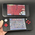New Nintendo 2DS XL (128GB) – 1000+ Games | Mario Kart 7 Limited Edition!